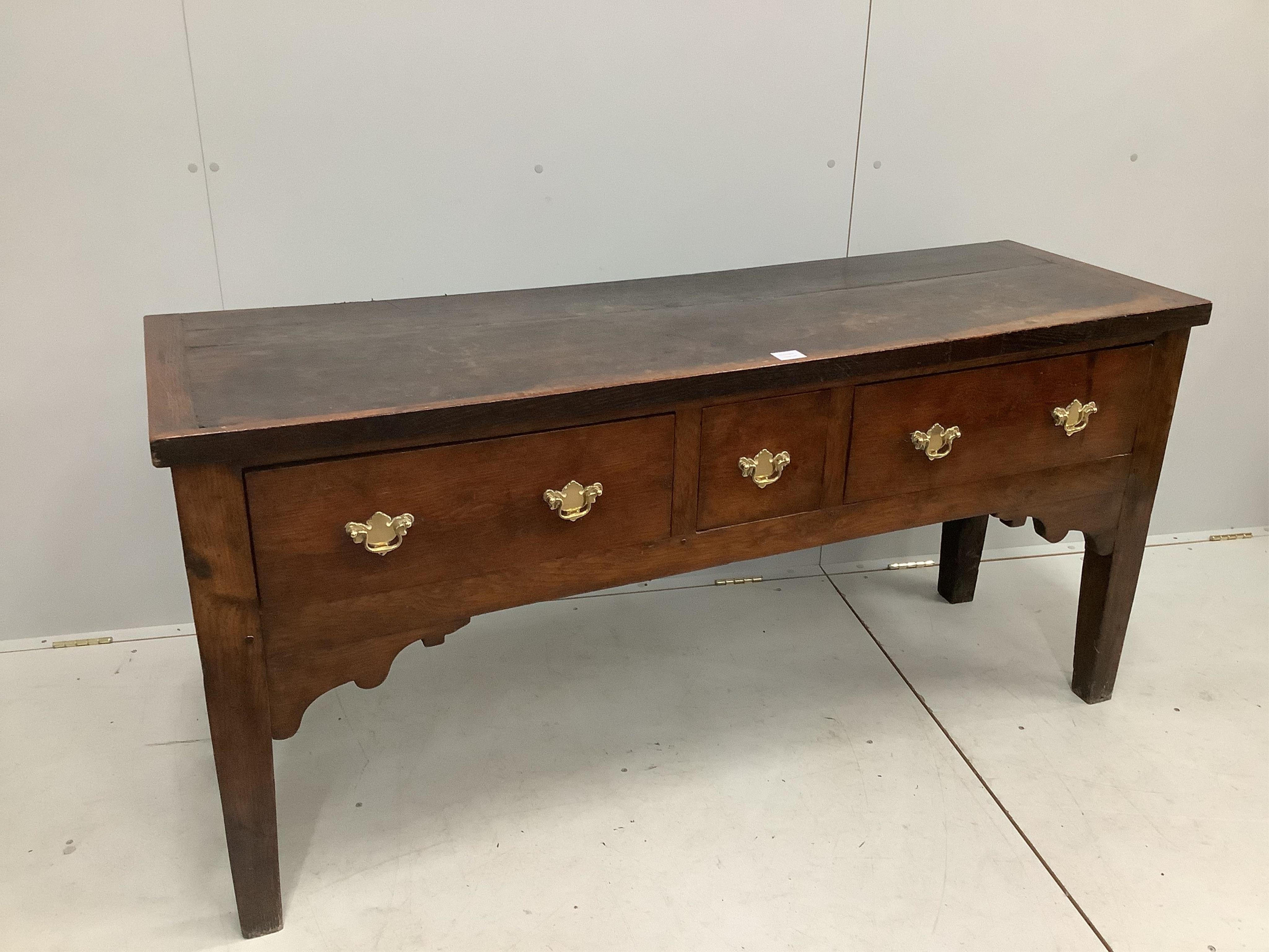 An 18th century style oak low dresser, width 157cm, depth 49cm, height 75cm. Condition - poor to fair